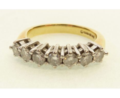 18CT GOLD SEVEN STONE DIAMOND HALF HOOP RING, the claw set brilliant cut diamonds 0.06ct approx. each, 0.42ct total carat wei