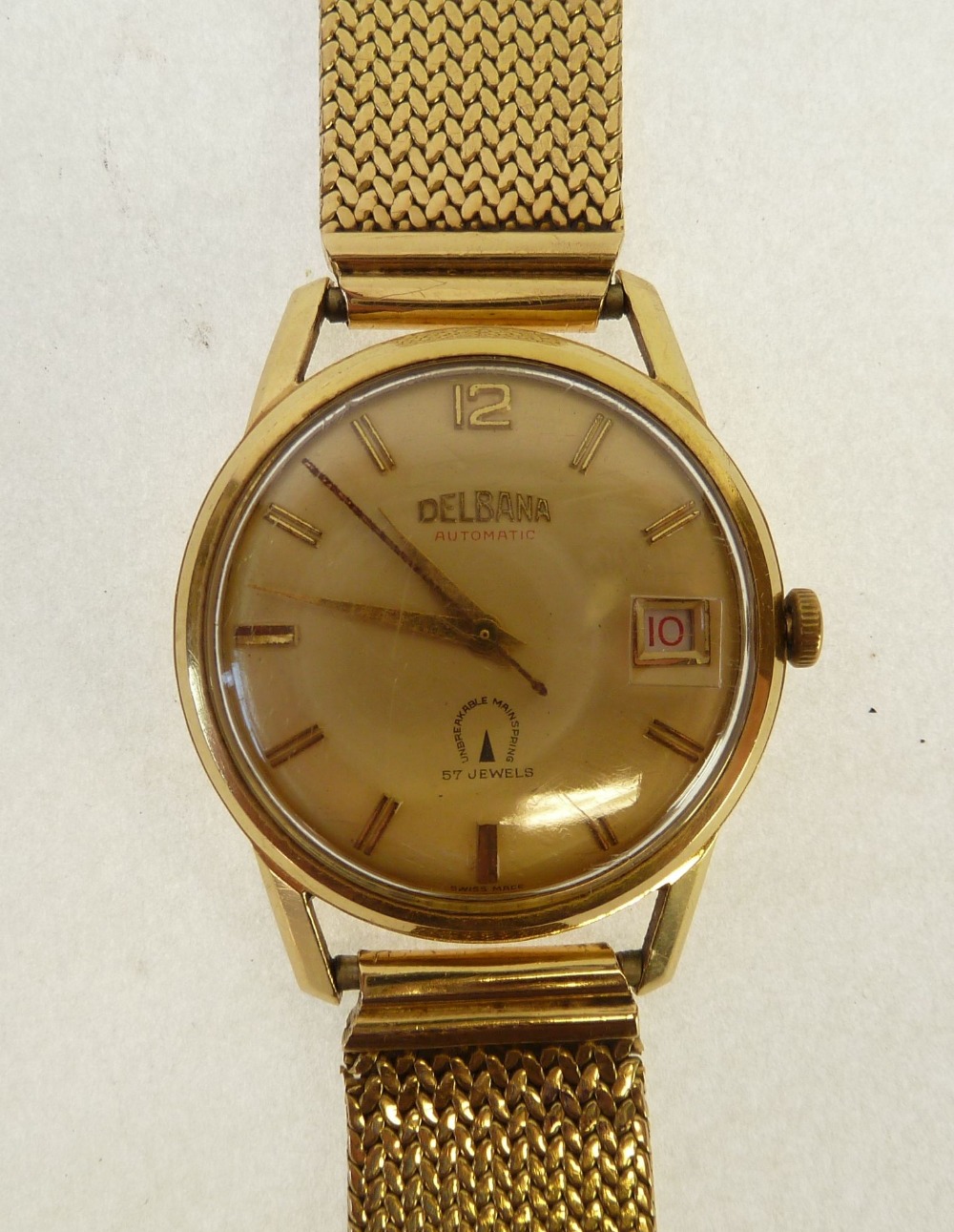 A DELBANA AUTOMATIC 18k GOLD CASED GENTLEMAN'S WRIST WATCH, with date ...