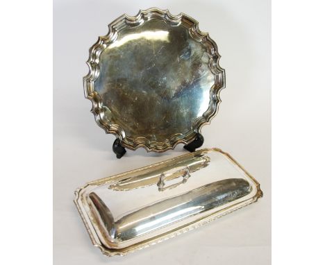AN ELECTROPLATE LARGE OBLONG ENTRÉE DISH AND COVER WITH REMOVEABLE HANDLE, 16 ¼" (41.2cm) long, AND A WALKER & HALL CHIPPENDA