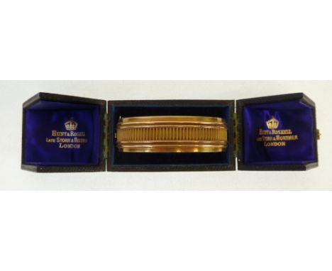 A VICTORIAN 18ct GOLD STIFF BANGLE, the original case inscribed to the purple silk lining 'Hunt and Roskell, Late Storr and M