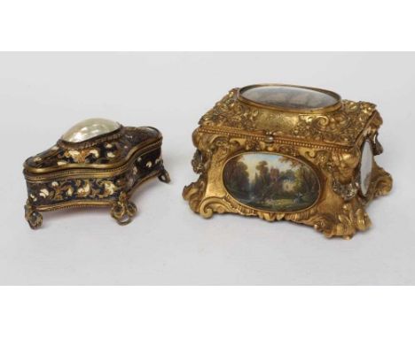 A GILT METAL ROCOCO REVIVAL JEWELLERY CASKET, late 19th century, with inset landscape scenes and red velvet lined interior, 6