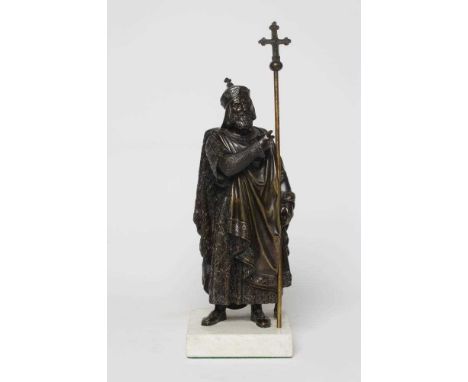 BRITISH SCHOOL (20th Century) Bronze of a Medieval Bishop wearing chainmail, a cloak and holding a staff, standing on a squar