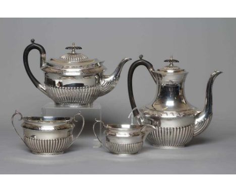 A COMPOSITE LATE VICTORIAN/EDWARDIAN SILVER FOUR PIECE TEA AND COFFEE SERVICE by Walker &amp; Hall, Sheffield 1899 (coffee po