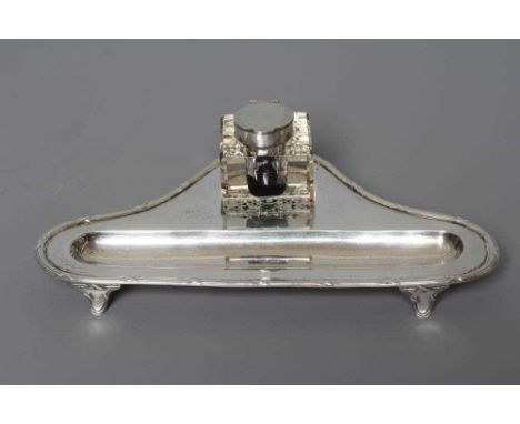 A SCOTTISH SILVER DESK STANDISH by Hamilton &amp; Inches, Edinburgh 1913, of triangular form with a reeded ribbon tied cast a