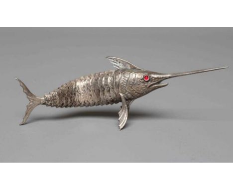 A SPANISH SILVER ARTICULATED SWORDFISH with chased detailing and collet set ruby glass cabochon eyes, marked on dorsal fin, 6