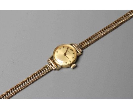 A LADY'S 18CT GOLD CASED ZENITH WRISTWATCH, the gilt dial with black Roman numerals, unnumbered seventeen jewel movement in a