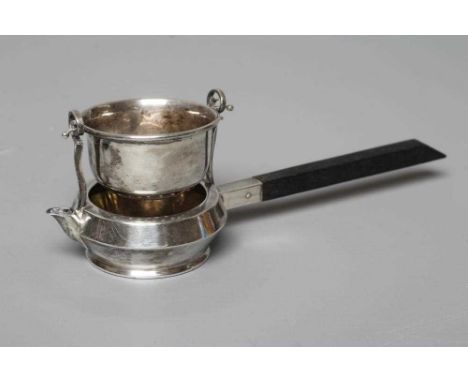 A SILVER TEA STRAINER ON STAND by Adie Brothers Ltd., Birmingham 1923, the plain pierced U strainer suspended on two scroll u