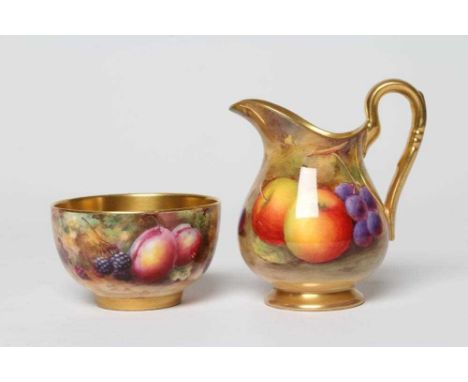 A ROYAL WORCESTER CHINA CREAM JUG, 1929, of baluster form painted by A. Shuck with a still life of two apples and black grape