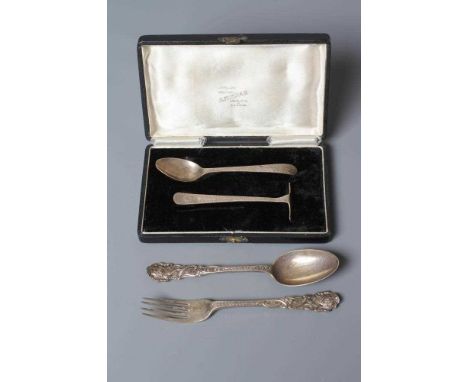 AN EDWARDIAN SILVER CHRISTENING SPOON AND FORK by Jackson &amp; Fullerton, London 1902/3, cast in the rococo style with carto