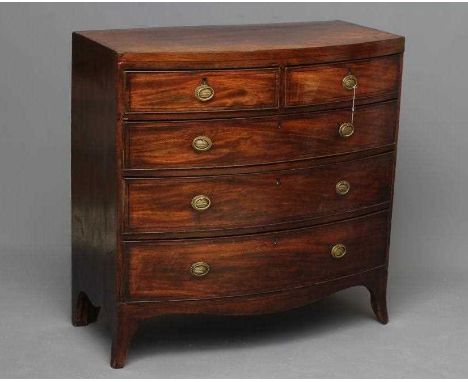 A REGENCY MAHOGANY BOWED CHEST, early 19th century, with ebony stringing, the caddy top over two short and three long drawers