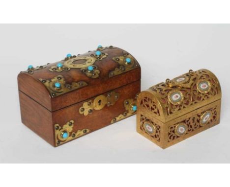 A VICTORIAN FIGURED WALNUT DOMED TEA CADDY with gilt metal mounts and turquoise cabochons, the interior with two rectangular 