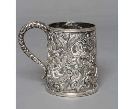 A CHINESE EXPORT SILVER CHRISTENING MUG by Kwong Man Shing (act.1875-1925), of tapering cylindrical form chased with two drag