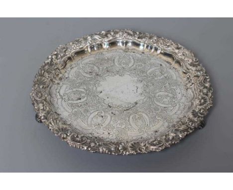 AN EDWARDIAN SILVER SMALL SALVER by William Hutton &amp; Sons Ltd., 1903, of shaped circular form, centrally chased with a sc