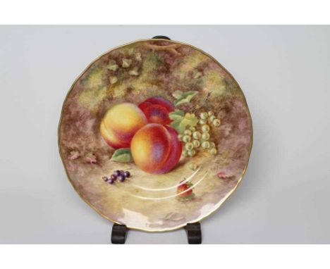 A ROYAL WORCESTER CHINA CABINET PLATE, 1954, of shaped circular form painted by Harry Ayrton with a rim to rim still life of 