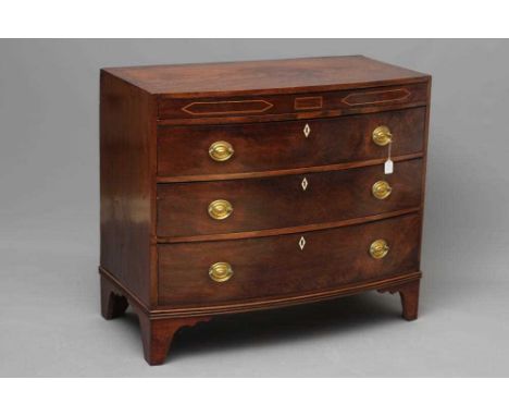 A REGENCY MAHOGANY BOWED CHEST, early 20th century, with stringing, the caddy top over inlaid secret frieze drawer, three lon