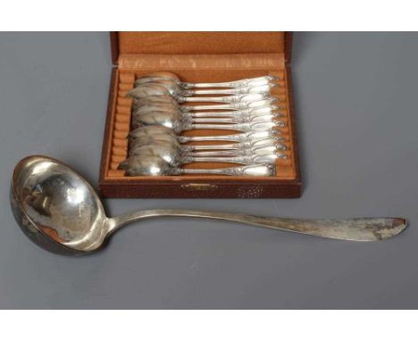A SET OF TWELVE FRENCH SILVER TEASPOONS, 950 standard, indistinct bigorne marks, with scroll cast finials, 5 1/2" long, toget