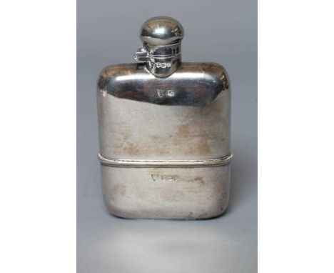 A SILVER HIP FLASK by G &amp; J W Hawksley, Sheffield 1931, of plain rounded oblong form with pull-off base and screw action 