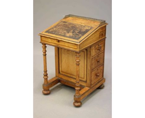 AN ASH AND ROSEWOOD BANDED DAVENPORT BY GILLOW, mid 19th century, with pierced brass gallery surmount and stringing, the red 