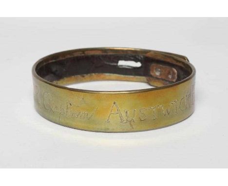 A BRASS DOG COLLAR, early 19th century, engraved 'T R Clapham, Austwick Hall', leather lined, 4 1/2" diameter on first apertu