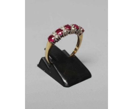 A RUBY AND DIAMOND HALF HOOP RING, the five facet cut rubies interspersed with four pairs of small brilliant cut diamonds to 