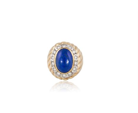 A LAPIS LAZULI AND DIAMOND DRESS RINGThe collet-set cabochon lapis lazuli within a frame of brilliant-cut diamonds, to a bomb