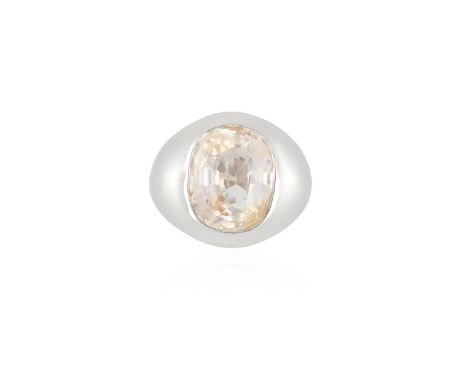 A COLOURED SAPPHIRE DRESS RINGThe cushion-shaped light pink sapphire weighing 13.13cts within collet setting, to a plain bomb