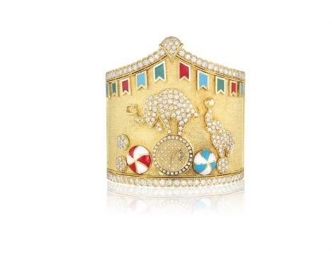 A GEM-SET AND GOLD 'CIRCUS' BANGLE WATCHThe machined central panel formed in a peak, the centre mounted with a circus elephan