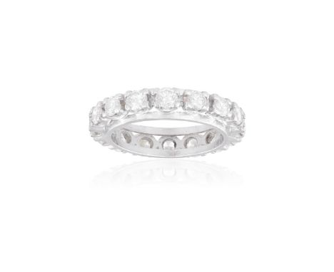A DIAMOND ETERNITY RINGSet with round brilliant-cut diamonds throughout, each within a four-claw setting, diamonds approximat