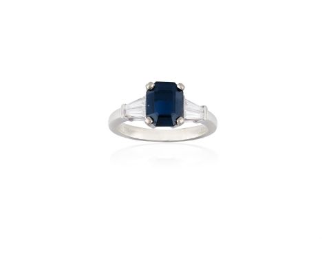 A SAPPHIRE AND DIAMOND RINGThe rectangular-cut sapphire weighing approximately 1.90cts, between tapered baguette-cut diamond 