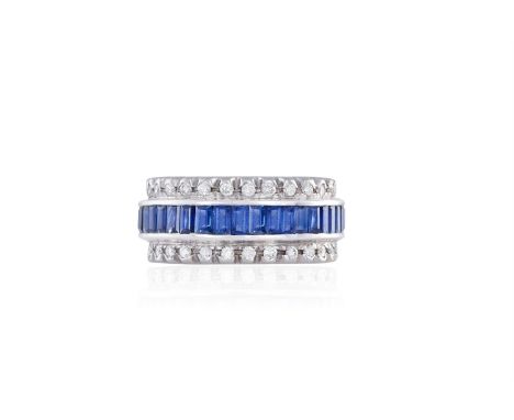 A SAPPHIRE AND DIAMOND RINGThe continuous row of baguette-cut sapphires within channel-setting, between a border of round bri