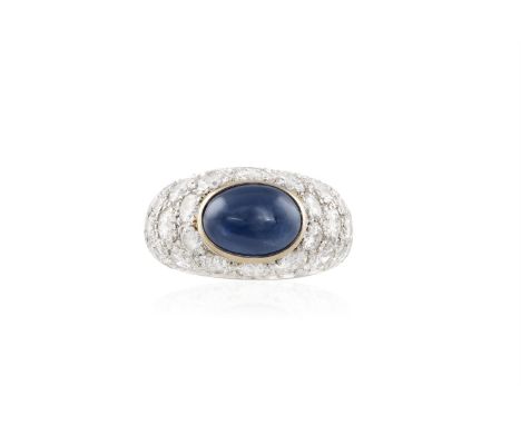 A SAPPHIRE AND DIAMOND RINGThe collet-set oval-shaped sapphire cabochon, within a domed brilliant-cut mount, mounted in 18K g