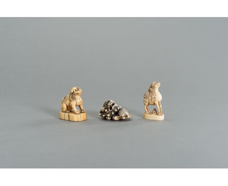 A GROUP OF THREE IVORY NETSUKE OF MYTHICAL ANIMALSJapan, 18th to 19th centuryThe first an early seal-type netsuke, the rectan