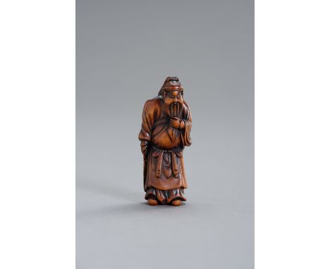 A WOOD NETSUKE OF KAN'UJapan, 19th century, Edo period (1615-1868)Depicting the god of war Kan'u stroking his long beard and 