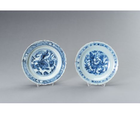 A PAIR OF MING DYNASTY 'BUDDHIST LION' DISHES, MUSEUM PROVENANCEChina, Ming Dynasty (1368-1644). The body with lobed rounded 