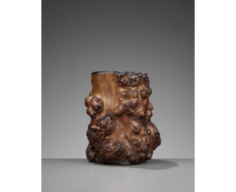 A BURLWOOD 'TREE TRUNK' BRUSHPOT, BITONG, MID-QINGChina, 18th-19th century. Naturalistically carved with protruding burls and