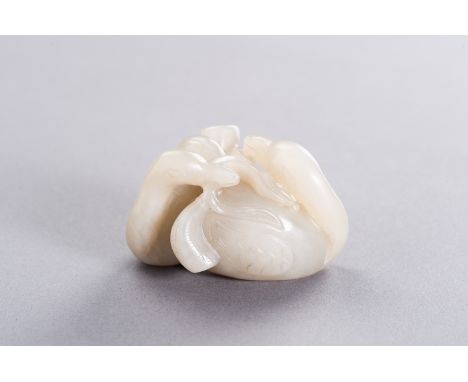 A CELADON JADE 'GEESE AND LOTUS' PENDANT, REPUBLICChina, Republic period (1912-1949). Carved as two geese side by side, each 