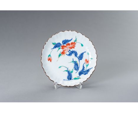 A LOBBED KAKIEMON PORCELAIN DISHJapan, 19th centuryThe lobed kakiemon dish delicately painted in underglaze blue as well as w