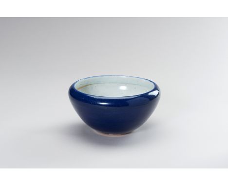 A SACRIFICIAL-BLUE GLAZED PORCELAIN BOWLChina, early Qing Dynasty (1644-1912). The exterior covered in a rich sacrificial-blu