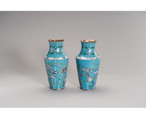 A PAIR OF CLOISONNE ENAMEL VASESChina, Qing Dynasty (1644-1912). Each with a baluster body rising from a short spreading foot