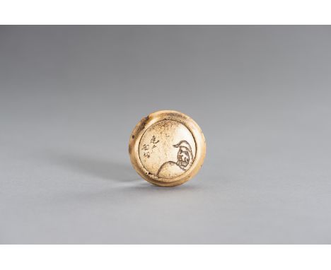 A STAG ANTLER KAGAMIBUTA NETSUKE WITH DARUMAJapan, late 19th centuryBoth the lid and bowl carved from stag antler, the lid wi
