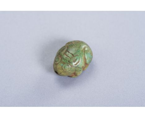 A TURQUOISE PENDANT DEPICTING A HAREChina, Ming Dynasty (1368-1644) or later. Very fine miniature depiction of a crouching ha