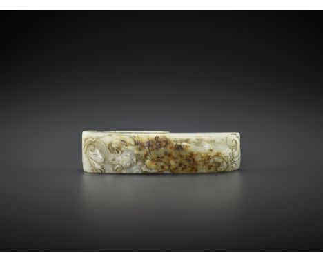 AN ARCHASITIC JADE SCABBARD SLIDE WITH DRAGON AMID CLOUDS, EARLY MINGJade. China, early Ming dynasty, 14th-15th centuryThe ex