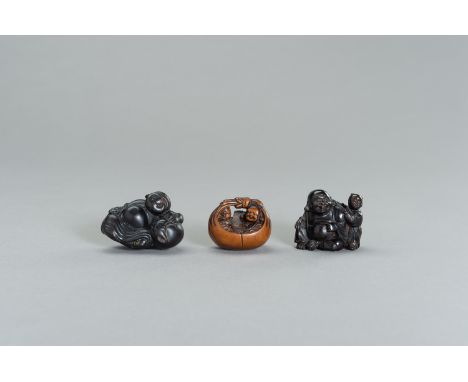 A GROUP OF THREE WOOD NETSUKE OF HOTEIJapan, 19th century, Edo period (1615-1868)The first of dark wood depicting Hotei leani