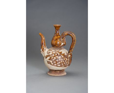 A GLAZED CERAMIC EWER WITH MYTHYCAL ANIMALSSouthern China, Ming Dynasty or later. The finely potted body supported on a splay