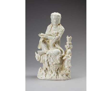 A LARGE DEHUA PORCELAIN SCULPTURE OF GUANYINChina, 20th century. The heavily potted figure with a thick ivory-white glaze, de