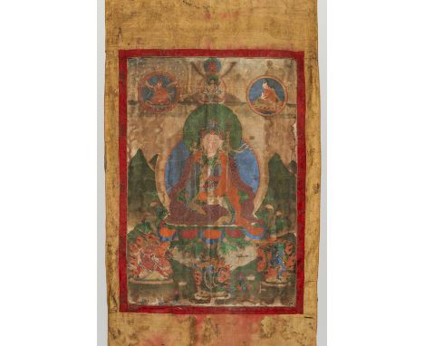 A THANGKA OF PADMASAMBHAVATibet, 18th to 19th century. Distemper on cloth. The Indian saint seated on a lotus throne holding 