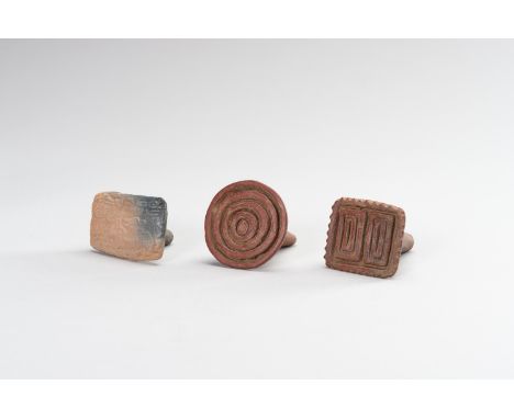 A GROUP OF THREE CERAMIC SEALSIndus Valley, 3rd-2nd Millennium BC or later. Comprising a rectangular seal carved to the base 