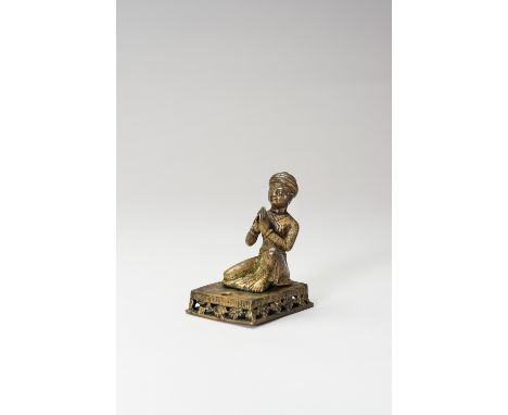 A SMALL BRONZE FIGURE OF A PRAYING WORSHIPPERNepal, 17-18th century. A bronze figure of a pious man wearing a Pagri hat and f