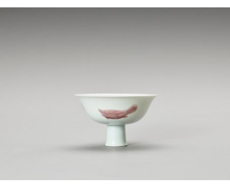 A GLAZED 'THREE FISH' STEM PORCELAIN BOWLChina, late Qing to Republic period (1900-1950). The Ming style porcelain bowl with 