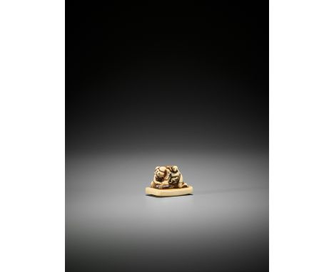 AN IVORY NETSUKE OF A SAGE WITH BAKUJapan, 18th century, Edo period (1615-1868)The ivory netsuke with a fine honey patina, de